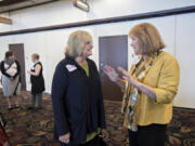 Washington first lady Trudi Inslee, center, chats with Mayor Pro Tem Anne McEnerny-Ogle before speaking to the crowd at the Support for Early Learning and Families Early Learning Summit at WareHouse ’23 on Tuesday morning. Inslee was among the speakers at the event before touring the Clark County Food Bank.