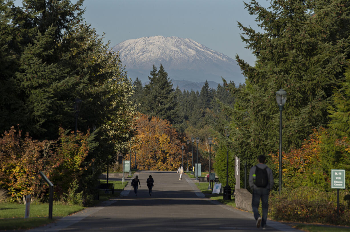 Students and visitors to Washington State University Vancouver take in scenic views of Mount St. Helens and fall colors as the sun shines on Tuesday afternoon. The school is among those in the Washington State University system facing impending budget cuts.