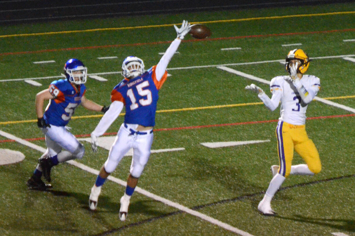 Columbia River receiver Kanen Eaton catches a touchdown pass despite the efforts of Ridgefield defensive back Carter Pankow at Ridgefield High School on Friday, October 27, 2017.