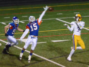 Columbia River receiver Kanen Eaton catches a touchdown pass despite the efforts of Ridgefield defensive back Carter Pankow at Ridgefield High School on Friday, October 27, 2017.