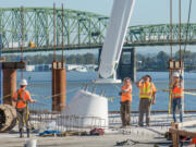 The 75-foot mast of the Grant Street Pier was installed this week. Galvanized steel cables running from the pier through the mast and into the ground will keep the pier aloft.