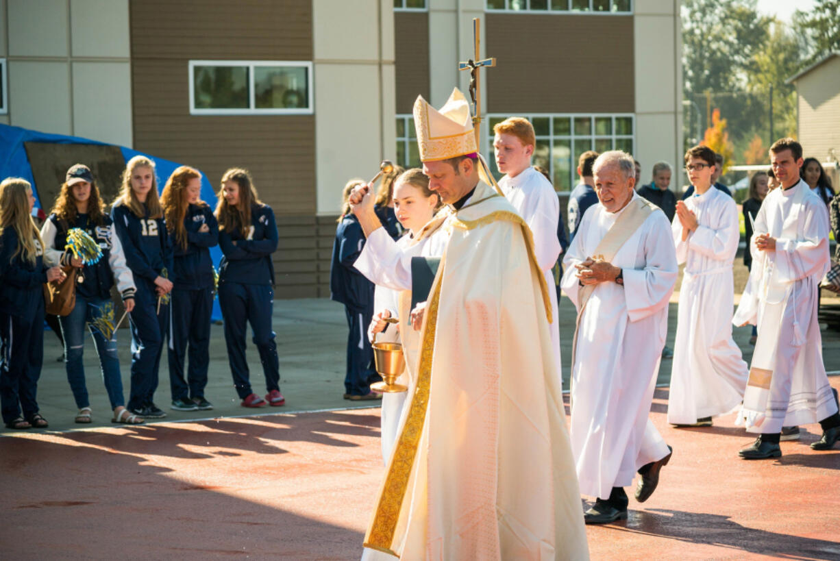 Five Corners: The Most Rev. Daniel Mueggenborg, an auxiliary bishop of the Seattle archdiocese, blessing new athletic fields at Seton Catholic High School on Oct. 14.