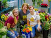 Woodland: Woodland High school junior Kylee Jones, from left, Mary Ellen Vetter, who teaches horticulture and floral design courses at the school, and Jennifer-Parkhill at Floral Design Institute’s FloraChopped competition last month, where the two Woodland teams finished first and second.