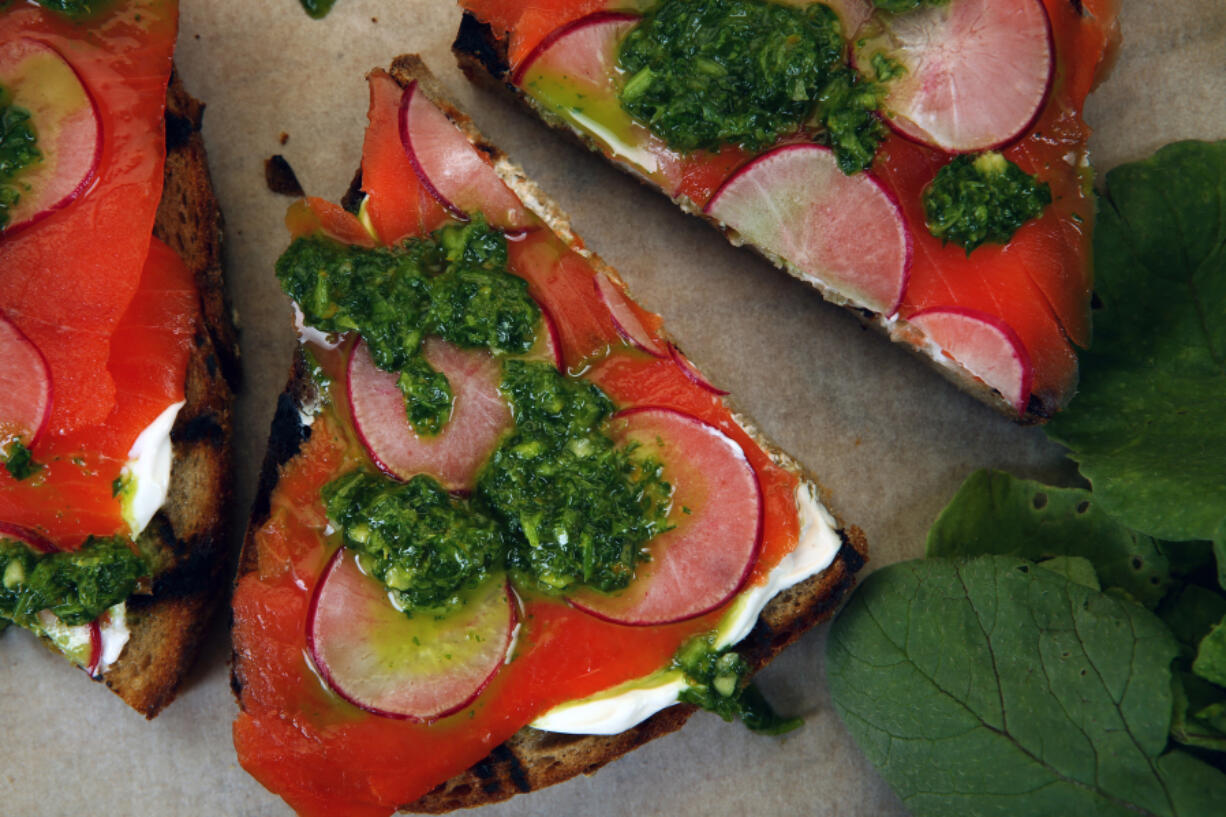 Salmon and radish green salsa verde toasts.