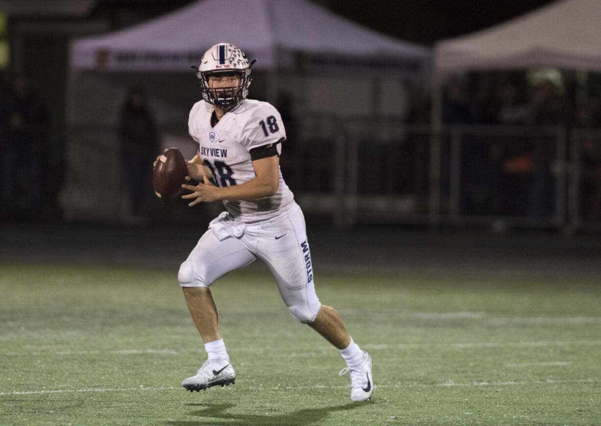 Skyview’s Max Rose (18) looks for an open receiver during the game against Battle Ground at Battle Ground District Stadium on Oct. 12, 2017.