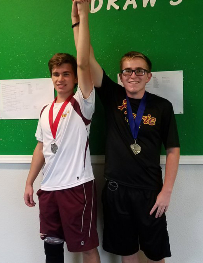 Injury default gives 3A district single title to Prairie’s Evan Prentice (right) over teammate David Kriss on Saturday, Oct. 21, 2017 at Club Green Meadows.