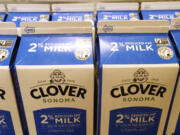 Cartons of milk packaged at the Clover Sonoma dairy plant bear the non-GMO label, signifying they do not contain genetically modified organisms.