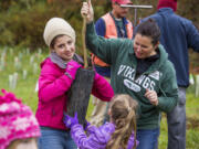 More than 200 volunteers helped Clark Public Utilities' StreamTeam plant 1,013 trees during the Make a Difference Day event at Washington State University Vancouver in 2013.