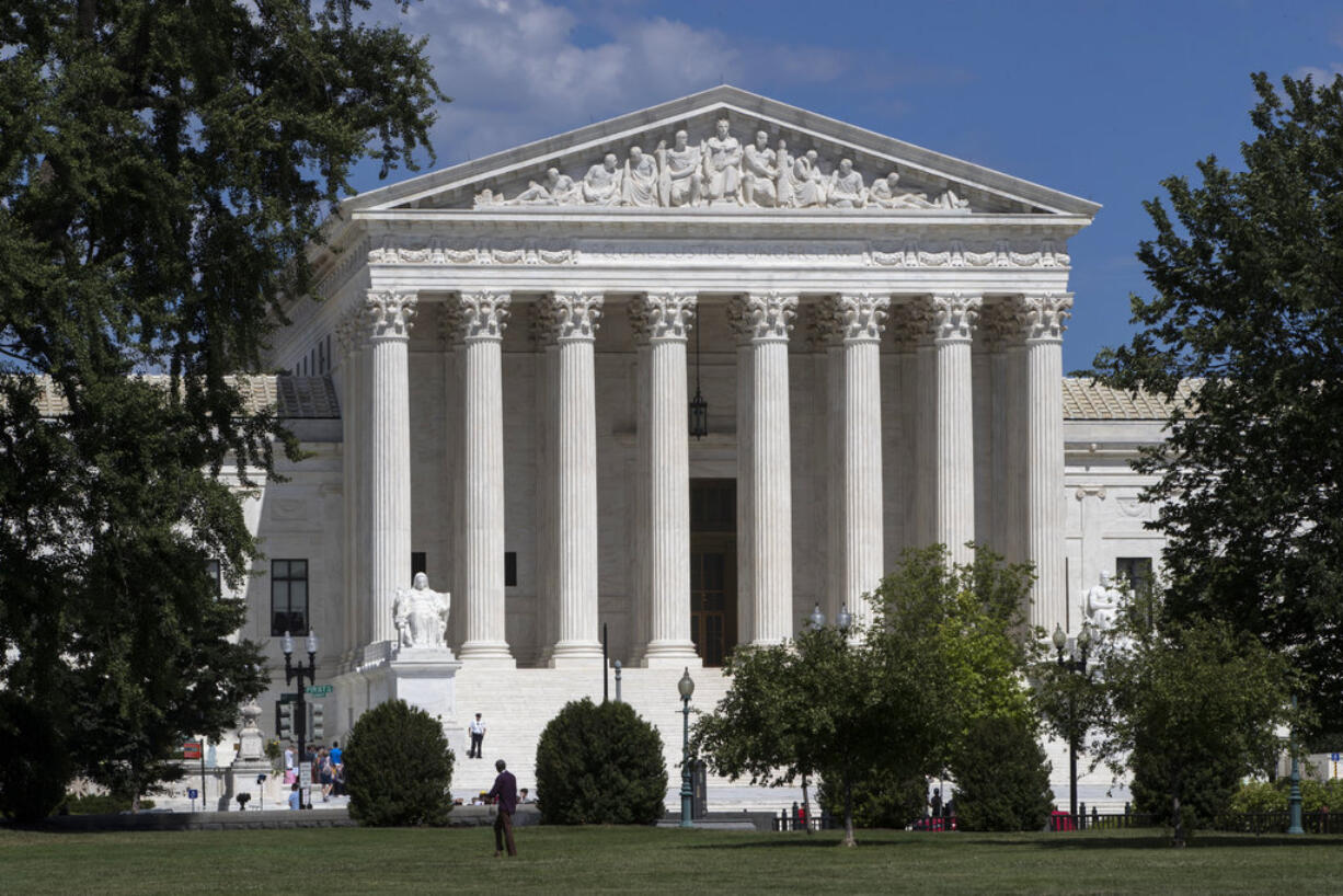 FILE - In this June 26, 2017, file photo, the Supreme Court is seen in Washington. The Supreme Court is taking up a case about political maps in Wisconsin that could affect elections across the country. The justices are hearing argument on Oct. 3 in a dispute between Democratic voters and Wisconsin Republicans who drew maps that have entrenched their control of the legislature in a state that is otherwise closely divided between the parties.  (AP Photo/J.