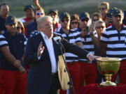 President Donald Trump speaks before presenting the winner's trophy to the U.S. Team after the final round of the Presidents Cup at Liberty National Golf Club in Jersey City, N.J., Sunday, Oct. 1, 2017.