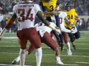 California's Ross Bowers (3) vaults into the end zone for a touchdown against Washington State during the fourth quarter of an NCAA college football game, Friday, Oct. 13, 2017, in Berkeley, Calif. The Golden Bears upset the eight-ranked Cougars, 37-3. (AP Photo/D.