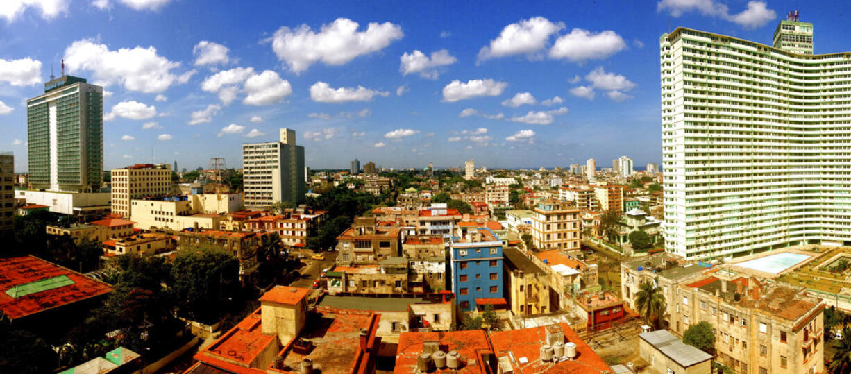 This image provided by Chris Allen shows the view in Havana, Cuba, from his hotel room - room 1414 - at Hotel Capri in April 2014. Allen’s phone started buzzing as word broke of invisible attacks hitting a U.S. government worker at Havana’s Hotel Capri. Allen’s friends and family had heard an eerily similar story from him before. The tourist from South Carolina had cut short his trip to Cuba two years earlier after numbness spread through all four of his limbs, just minutes after he climbed into bed at the same hotel. Those weren’t the only parallels in Allen’s recounting, which put him in a growing list of Americans with no government connections, asking the same alarming but unanswerable question: Were we victims, too?