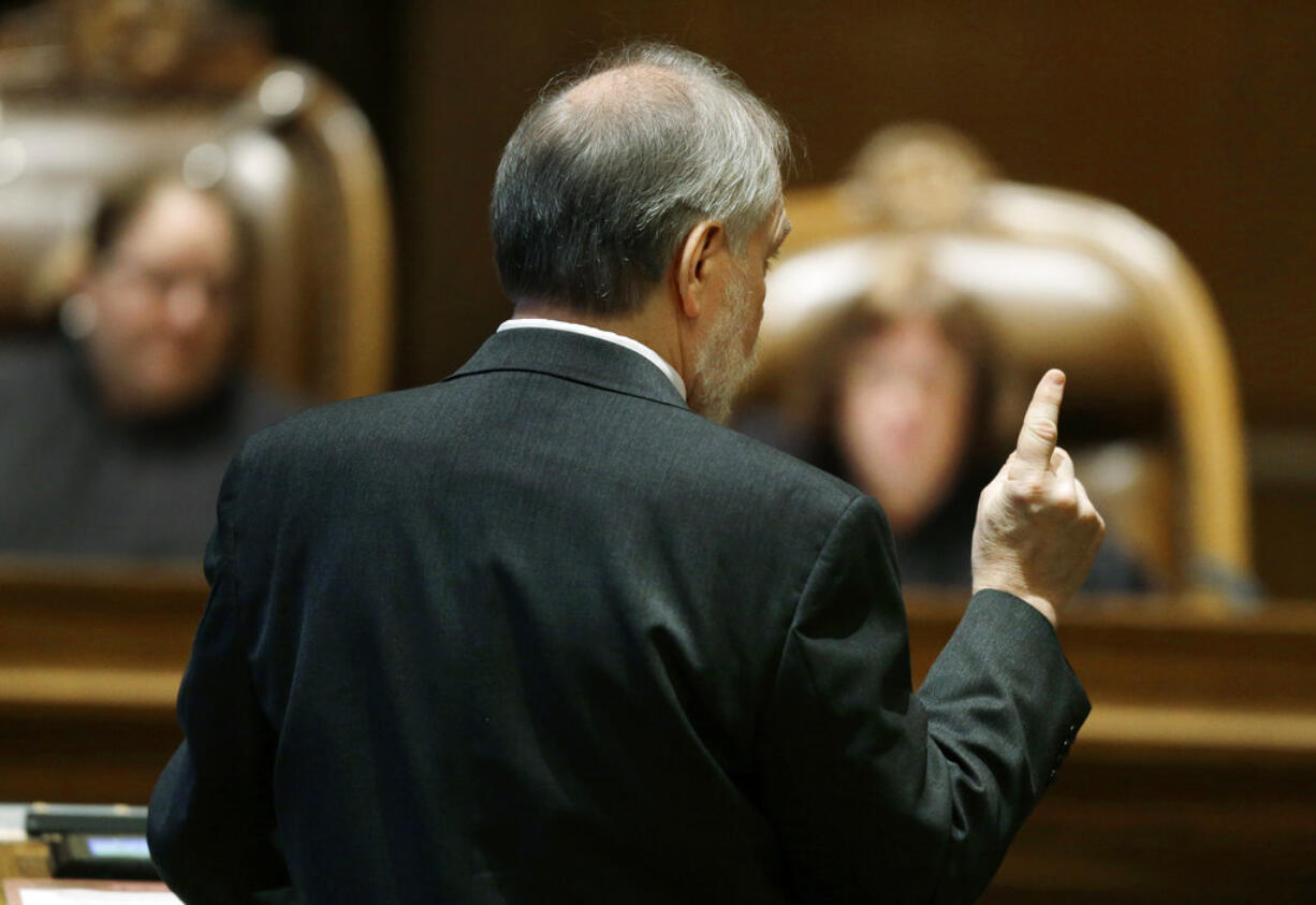 Alan Copsey, deputy solicitor general in the Washington state attorney general's office, speaks Tuesday, Oct. 24, 2017, during a Washington Supreme Court hearing in Olympia, Wash. The hearing was held to determine if Washington state has complied with a court mandate to fully fund the state's basic education system. (AP Photo/Ted S.