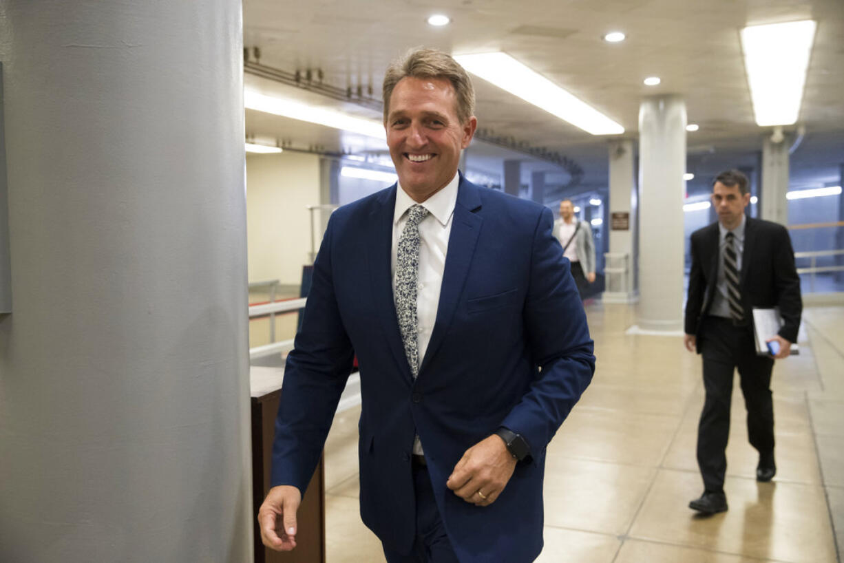 Sen. Jeff Flake, R-Ariz., a member of the Foreign Relations Committee, arrives for the start of a closed-door security briefing at the Capitol in Washington, Wednesday, Oct. 25, 2017. (AP Photo/J.