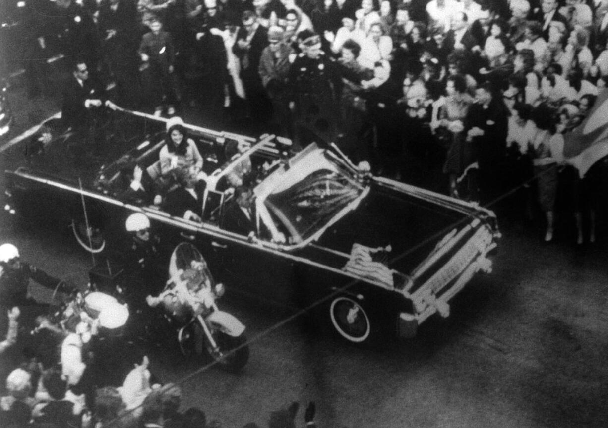 This image provided by the Warren Commission is  an overhead view of President John F. Kennedy's car in Dallas motorcade on Nov. 22, 1963, and was the commission's Exhibit No. 698. Special agent Clinton J. Hill is shown riding atop the rear of the limousine. President Donald Trump is caught in a push-pull on new details of Kennedy’s assassination, jammed between students of the killing who want every scrap of information and intelligence agencies that are said to be counseling restraint.  How that plays out should be known on Oct. 26, 2017, when long-secret files are expected to be released.