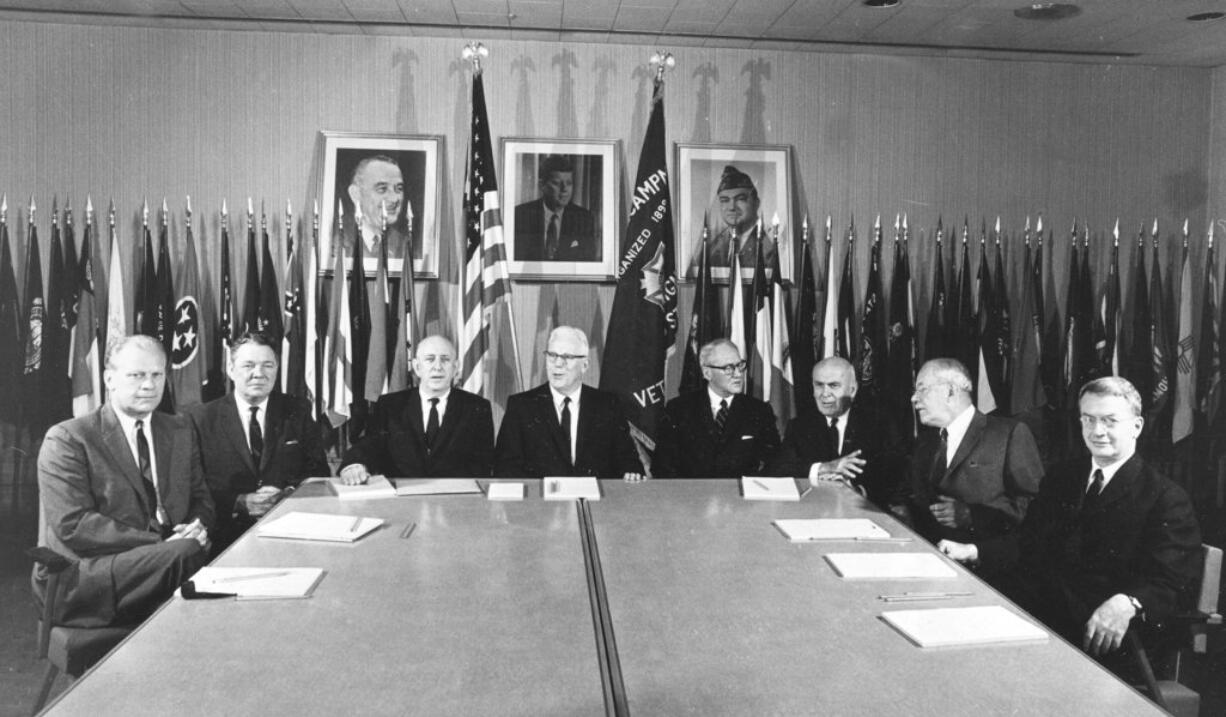 FILE - In this Aug. 14, 1964, file photo, the bipartisan presidential commission to investigate the assassination of President John F. Kennedy sits for an official picture, at the Veterans of Foreign Wars office on Capitol Hill, in Washington. From left, are: Rep. Gerald R. Ford, R-Mich.; Rep. Hale Boggs, D-La.; Sen. Richard Russell, D-Ga.; Chief Justice Earl Warren, chairman of the group; Sen. John Sherman Cooper, R-Ky.; John J. McCloy, a New York banker; Allen W. Dulles, former director of the Central Intelligence Agency; and J. Lee Rankin, general counsel for the commission.