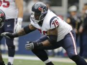 Houston Texans tackle Duane Brown on the field before an NFL football game against the Seattle Seahawks, Sunday, Oct. 29, 2017, in Seattle.