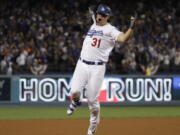 Los Angeles Dodgers’ Joc Pederson celebrates after hitting a home run during the seventh inning of Game 6 of baseball’s World Series against the Houston Astros Tuesday, Oct. 31, 2017, in Los Angeles.