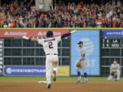 Houston Astros’ Alex Bregman reacts after hitting in the game-winning run during the 10th inning of Game 5 of baseball’s World Series against the Los Angeles Dodgers Monday, Oct. 30, 2017, in Houston. The Astros won 13-12 to take a 3-2 lead in the series. (AP Photo/David J.