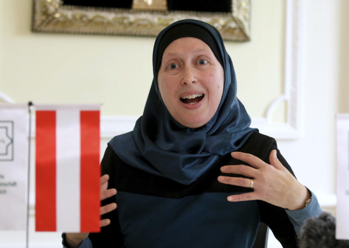 Carla Amina Baghajati from the Austrian Islamic Religious Community gestures during an interview with The Associated Press in Vienna, Austria.