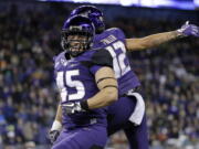 Washington's Jusstis Warren celebrates his touchdown against California with Aaron Fuller in the second half of an NCAA college football game Saturday, Oct. 7, 2017, in Seattle.