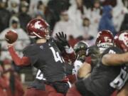 Washington State quarterback Luke Falk (4) throws a pass during the first half of an NCAA college football game against Colorado in Pullman, Wash., Saturday, Oct. 21, 2017.