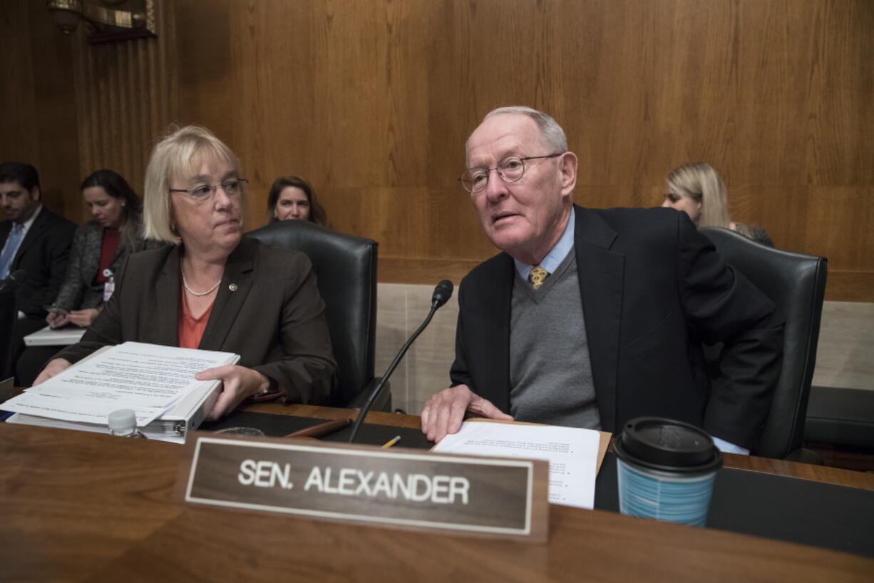 Sen. Patty Murray, D-Wash., the ranking member, and Sen. Lamar Alexander, R-Tenn., chairman of the Senate Health, Education, Labor, and Pensions Committee, meet before the start of a hearing on Capitol Hill in Washington on Wednesday the morning after they reached a deal to resume federal payments to health insurers that President Donald Trump had halted. (AP Photo/J.