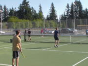 The Evergreen tennis team on the practice court (Tim Martinez/The Columbian)