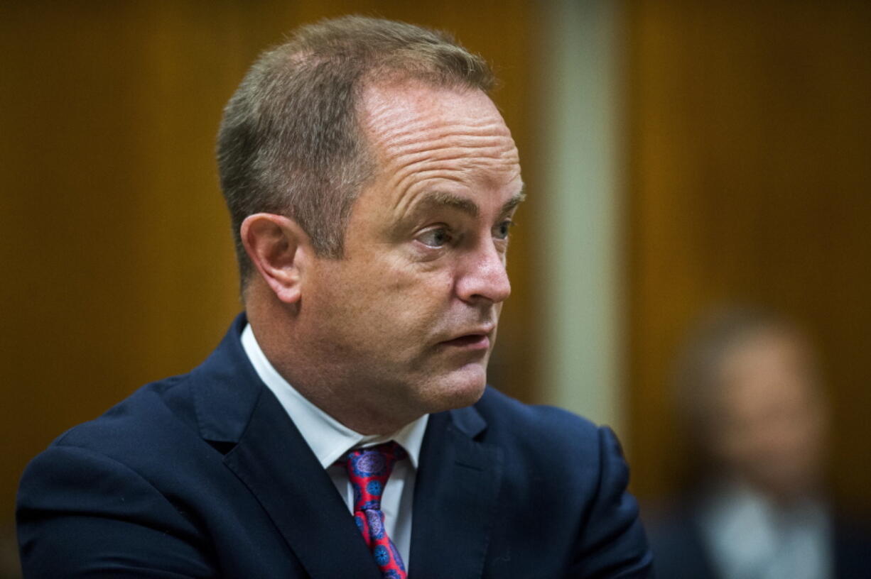 Special Prosecutor Todd Flood speaks in court during the first day of the preliminary examination of Dr. Eden Wells, chief medical executive of the Michigan Department of Health and Human Services, on Monday in District Court in Flint, Mich. The hearing was postponed when prosecutors said they would add a charge of involuntary manslaughter.