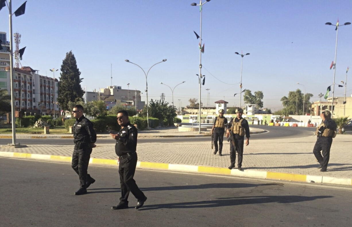 Local police are deployed in Kirkuk, 290 kilometers north of Baghdad, Iraq, on Monday. Iraqi Kurdish officials said early Monday that federal forces and state-backed militias have launched a “major, multi-pronged” attack aimed at retaking the disputed northern city of Kirkuk, causing “lots of casualties” in fighting south of the city.