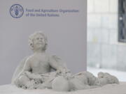 This photo shows a marble statue representing the tragedy of migration donated by Pope Francis during his visit to the United Nations Food and Agriculture Organization (FAO) on the occasion of the World Food Day, Monday, Oct. 16, 2017. The statue commemorates Aylan Kurdi, the 3-year old refugee boy drowned on Sept. 2015 while crossing the Mediterranean Sea.