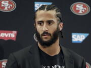 Then San Francisco 49ers quarterback Colin Kaepernick speaking at a news conference after the team’s NFL football game against the Seattle Seahawks in Santa Clara, Calif. NFL spokesman Joe Lockhart says the league expects Colin Kaepernick to be invited to the next meeting between owners and players to discuss social justice initiatives. Lockhart adds that the meeting probably will take place next week.