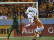 Portland Timbers goalkeeper Jeff Attinella (1) collides with Houston Dynamo forward Mauro Manotas (19) as he comes out to get the ball away from Manotas during the MLS Western Conference semifinal soccer match Monday, Oct. 30, 2017, in Houston.