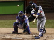 Los Angeles Dodgers’ Enrique Hernandez (14) hits a home run off Chicago Cubs starting pitcher Jose Quintana during the second inning of Game 5 of baseball’s National League Championship Series, Thursday, Oct. 19, 2017, in Chicago.