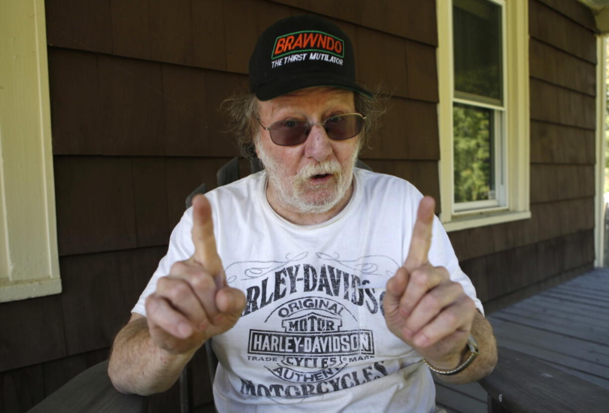 Nobel Prize winner Jeffrey C. Hall speaks to a reporter Monday at his home in Cambridge, Maine. Hall, along with Michael Rosbash and Michael W. Young, won the $1.1 million prize for their work on finding genetic mechanisms behind circadian rhythms.