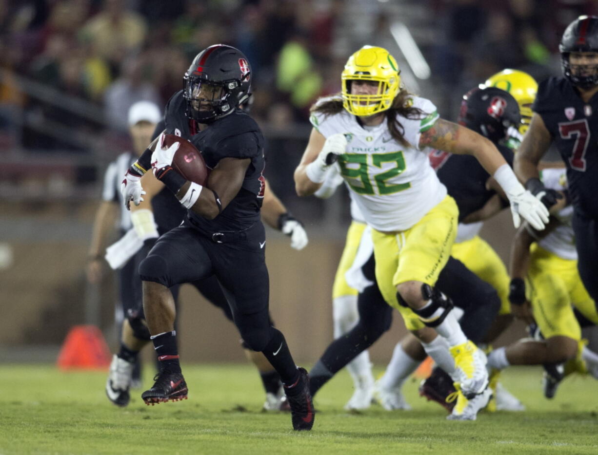 Stanford’s Bryce Love (20) breaks free for a long touchdown against Oregon during the first quarter of an NCAA college football game, Saturday, Oct. 14, 2017, in Stanford, Calif. (AP Photo/D.