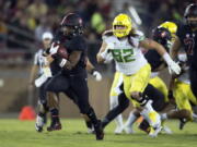 Stanford’s Bryce Love (20) breaks free for a long touchdown against Oregon during the first quarter of an NCAA college football game, Saturday, Oct. 14, 2017, in Stanford, Calif. (AP Photo/D.