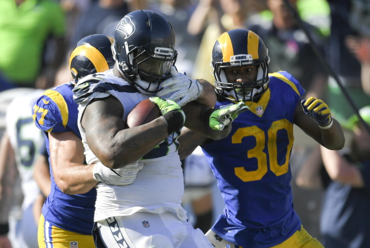 Seattle Seahawks defensive tackle Sheldon Richardson is tackled after recovering a fumble against the Los Angeles Rams during the second half of an NFL football game Sunday, Oct. 8, 2017, in Los Angeles.(AP Photo/Mark J.