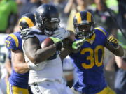 Seattle Seahawks defensive tackle Sheldon Richardson is tackled after recovering a fumble against the Los Angeles Rams during the second half of an NFL football game Sunday, Oct. 8, 2017, in Los Angeles.(AP Photo/Mark J.