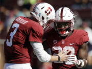 FILE - In this Sept. 30, 2017, file photo, Stanford running back Bryce Love, right, celebrate his rushing touchdown with teammate K.J. Costello during the third quarter of an NCAA college football game against Arizona State in Stanford, Calif. Heisman Trophy candidate Bryce Love will be a game-time decision for No. 20 Stanford against Oregon State on Thursday night.