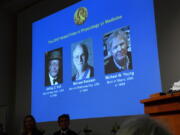 Winners of the 2017 Nobel Prize for Medicine are displayed, from left, Jeffrey C. Hall, Michael Rosbash and Michael W. Young, during a press conference in Stockholm, Monday. The Nobel Prize for Medicine has been awarded to the three Americans for discoveries about the body’s daily rhythms.