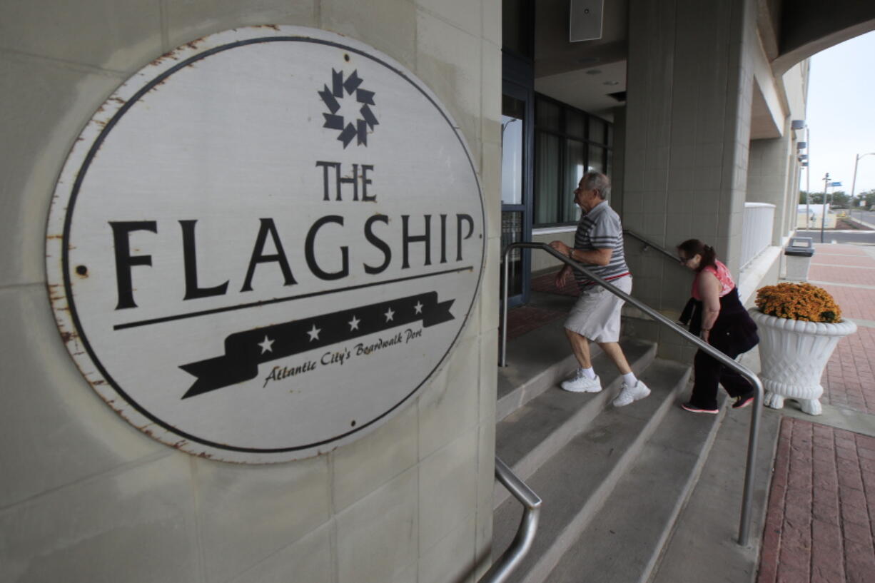 In a photo taken Wednesday, Sept. 27, 2017, a couple makes its way into the Flagship Resort in Atlantic City, N.J. The resort offers timeshares space for its guests.