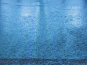 Rain drops fall on a flooded street in downtown Mobile, Ala., during Hurricane Nate, Sunday, Oct. 7, 2017. Hurricane Nate came ashore along Mississippi's coast outside Biloxi early Sunday, the first hurricane to make landfall in the state since Hurricane Katrina in 2005.