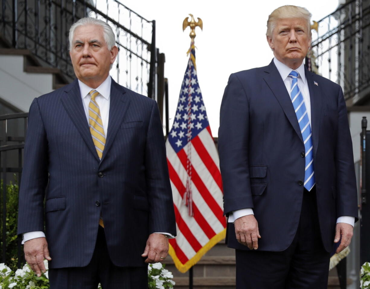 President Donald Trump, right, stands with Secretary of State Rex Tillerson at a press conference Aug. 11 at Trump National Golf Club in Bedminster, N.J.