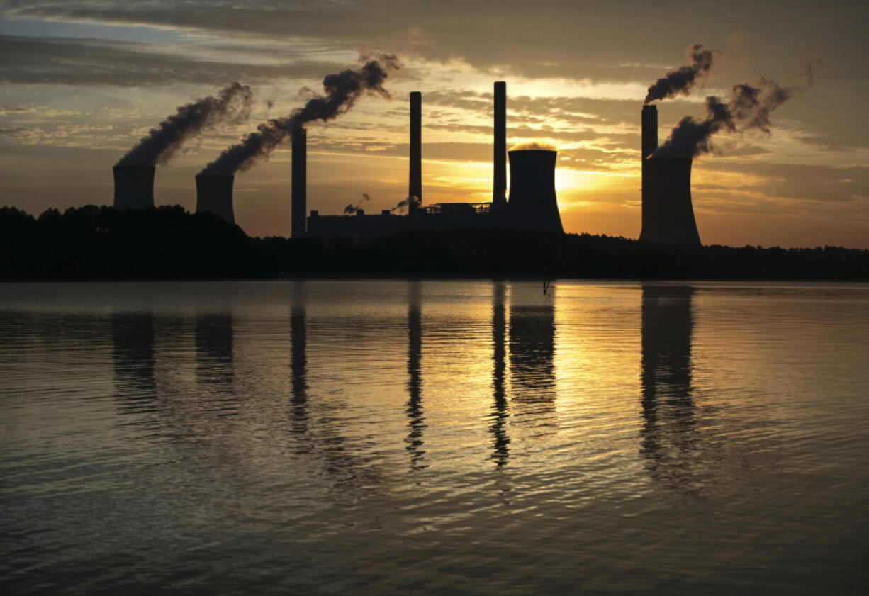 The coal-fired Plant Scherer, one of the nation’s top carbon dioxide emitters, stands in the distance in Juliette, Ga. The Trump administration intends to roll back the centerpiece of former President Barack Obama’s efforts to slow global warming, seeking to ease restrictions on greenhouse gas emissions from coal-fired power plants.