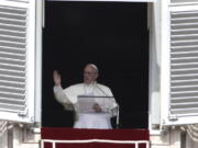 Pope Francis delivers his blessing Sept. 24 during the Angelus noon prayer from the window of his studio overlooking St. Peter’s Square, at the Vatican.