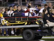 Washington defensive back Jordan Miller (23) is carted off the field due to injury during the second half of an NCAA college football game against Arizona State Saturday, Oct. 14, 2017, in Tempe, Ariz. Arizona State defeated Washington 13-7. (AP Photo/Ross D.