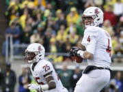 Washington State quarterback Luke Falk (4) looks for a receiver against Oregon in an NCAA college football game Saturday, Oct. 7, 2017 in Eugene, Ore.