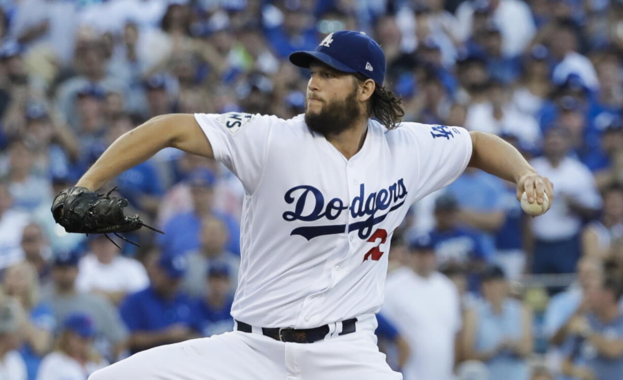 Los Angeles Dodgers starting pitcher Clayton Kershaw throws during the first inning of Game 1 of baseball’s World Series against the Houston Astros Tuesday, Oct. 24, 2017, in Los Angeles. (AP Photo/David J.