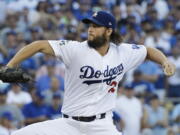 Los Angeles Dodgers starting pitcher Clayton Kershaw throws during the first inning of Game 1 of baseball’s World Series against the Houston Astros Tuesday, Oct. 24, 2017, in Los Angeles. (AP Photo/David J.